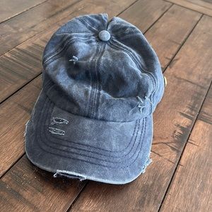 Pony tail hat with mask attachment button